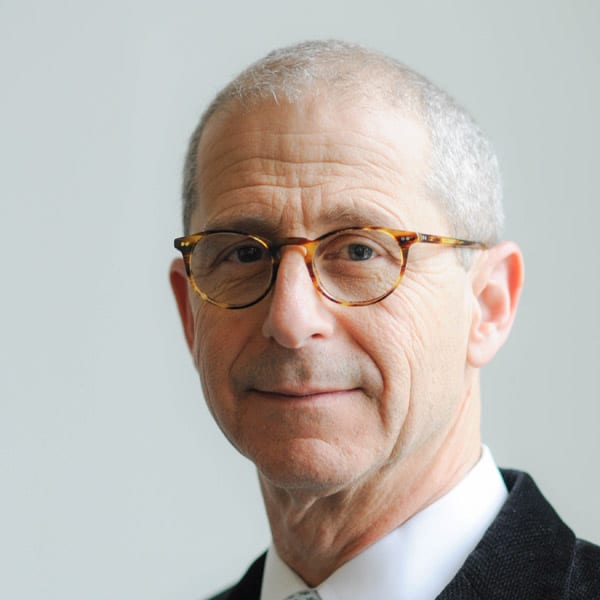 Taylor Executive Director Kenneth Schwartz's Face Looking At The Camera In Front Of A Gray Background.