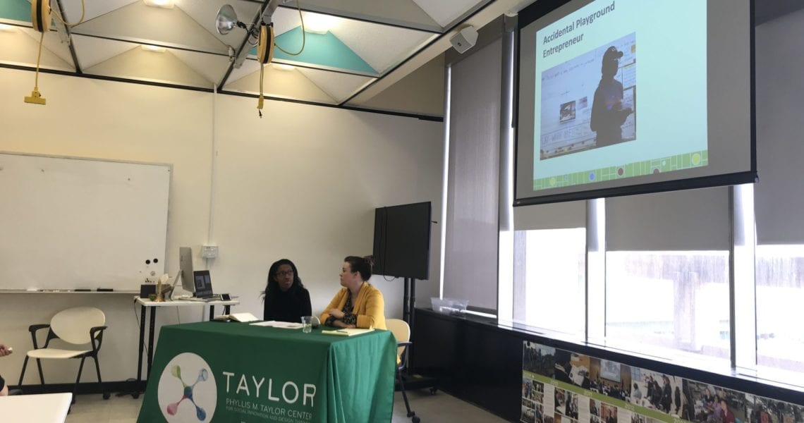Angela Kyle, Accidental Playground Entrepreneur And Director Of Playbuild NOLA, Sits At A Table In A Classroom Her Story At Taylor's Social Innovation Conversation In February 2020.